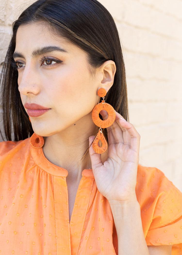 Alani Raffia Drop-Orange-Hand In Pocket