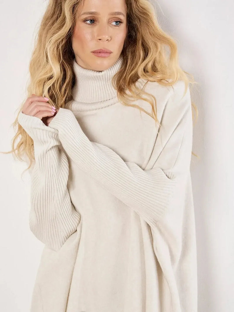 Apricot Roll Neck Fringe Poncho- Cream-Hand In Pocket
