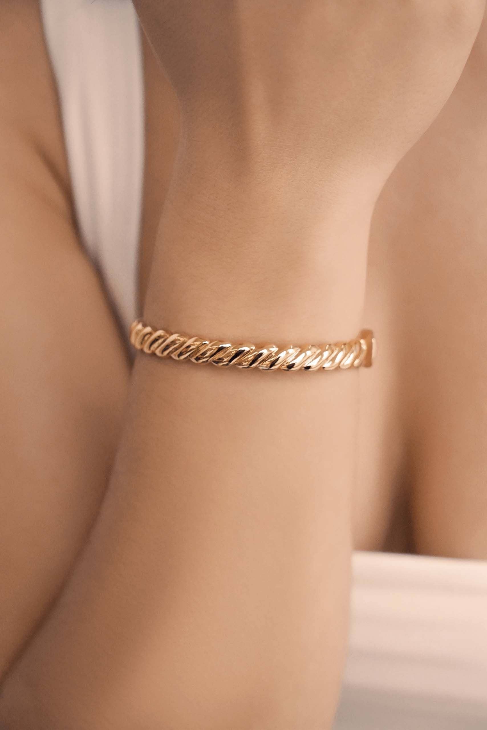 Twisted Stacking Bangle: 18k Gold Plated / One Size-Hand In Pocket