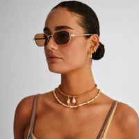 Le Specs Mythic - Gold-Hand In Pocket