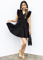 Elan Breezy in Black Dress-Hand In Pocket