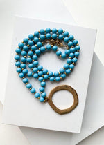 Snug Corner Long Beaded Turquoise Beaded Pendant-Hand In Pocket