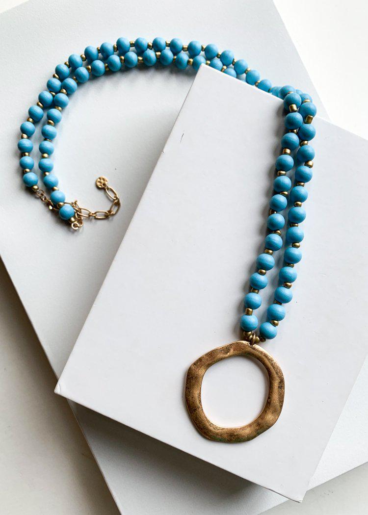 Snug Corner Long Beaded Turquoise Beaded Pendant-Hand In Pocket