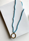 Snug Corner Long Beaded Turquoise Beaded Pendant-Hand In Pocket