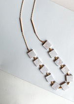 Tik Tac White and Gold Loop Necklace-Hand In Pocket